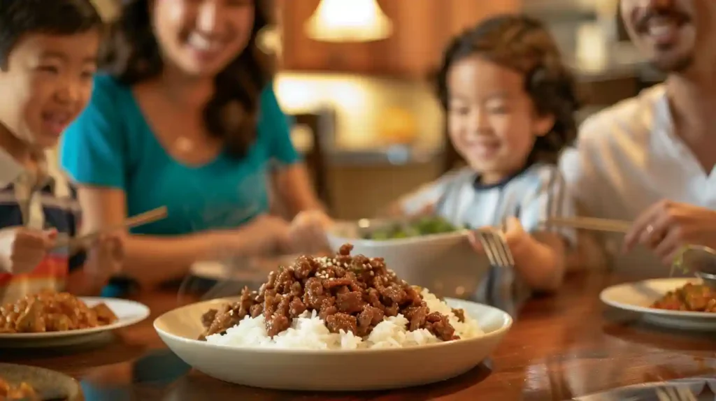Happy family enjoying Mongolian ground beef over rice at a dinner table in a cozy home setting.