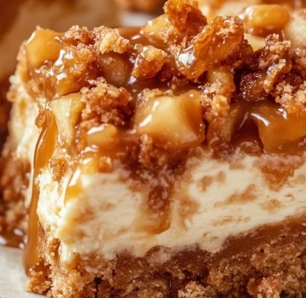 Delicious caramel apple cheesecake bars with a caramel drizzle