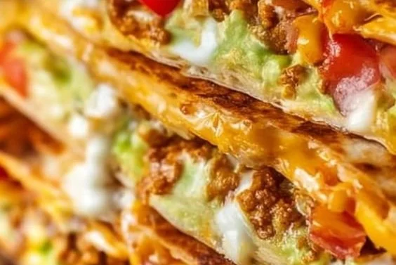 Homemade Copycat Crunchwrap Supreme featuring layers of toppings and tortillas.